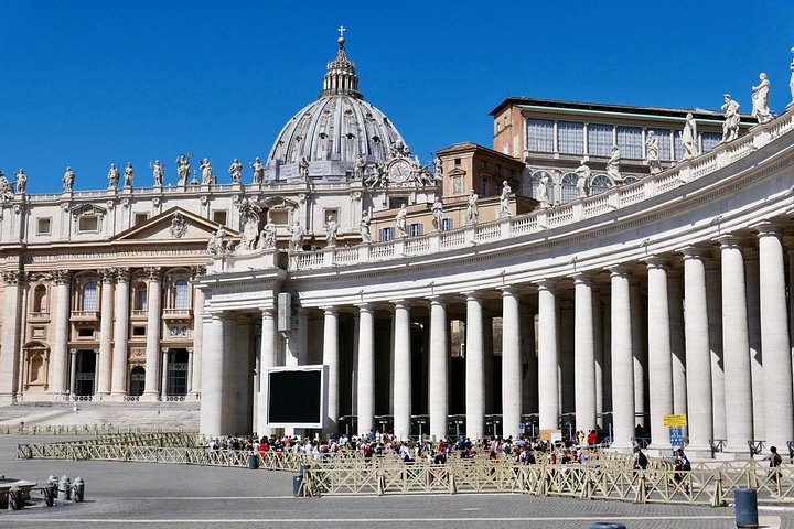The colonnade of St. Peter’s Square with the Basilica behind it