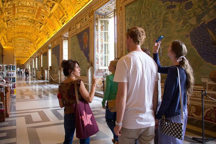Visitors and a guide in the Gallery of Maps
