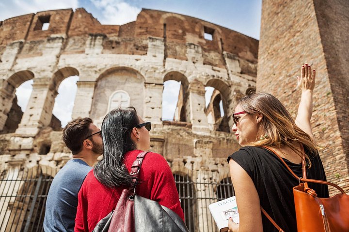 Visitors beside the Colosseum